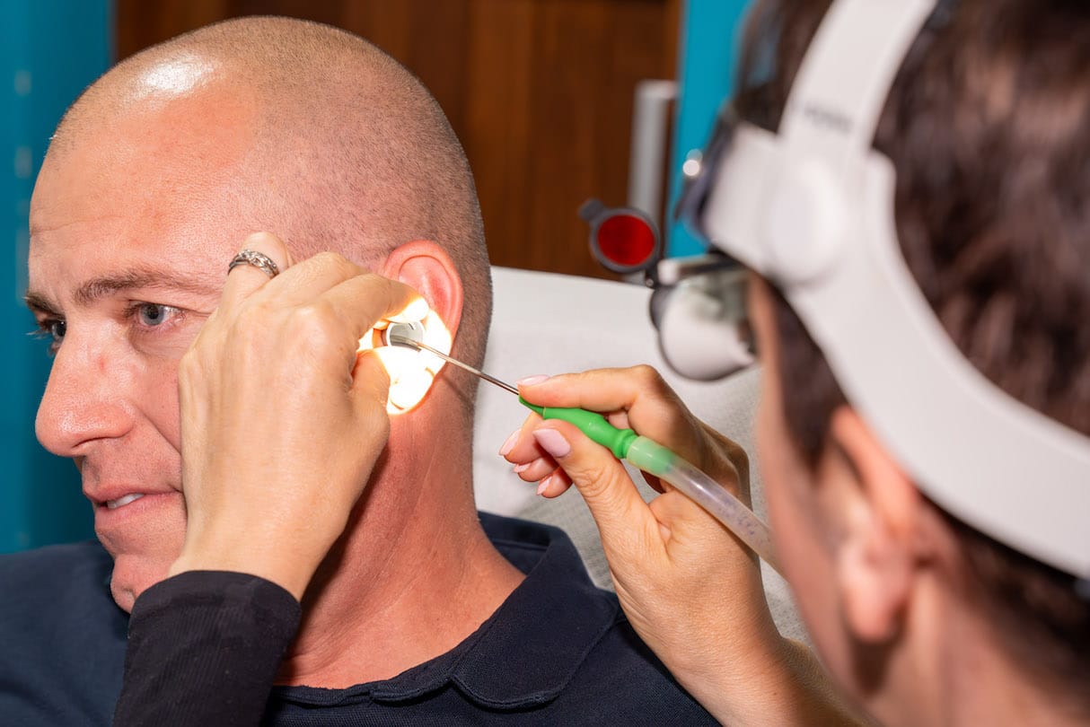 Patient getting microsuction earwax removal procedure