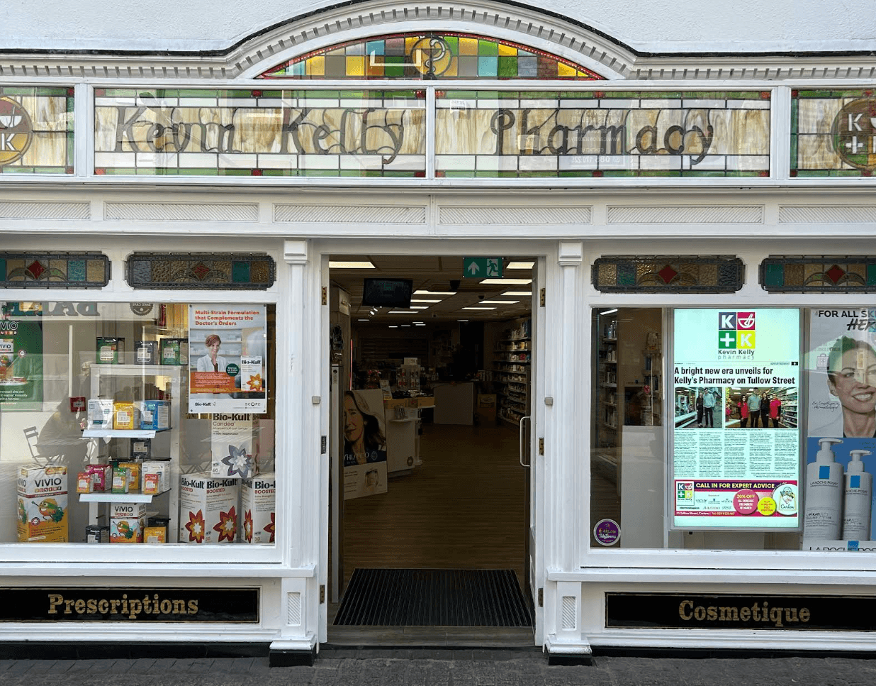 Kevin Kelly Pharmacy storefront, prescriptions and cosmetics available.