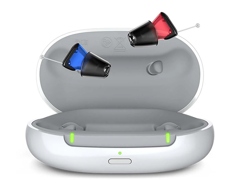 Hearing aids in a charging case; one with red, one with blue indicator.