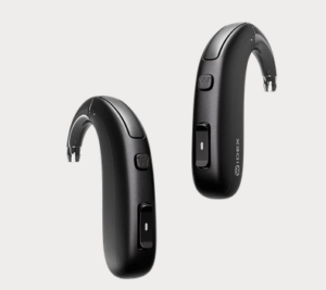 Pair of black Widex hearing aids on a neutral background.